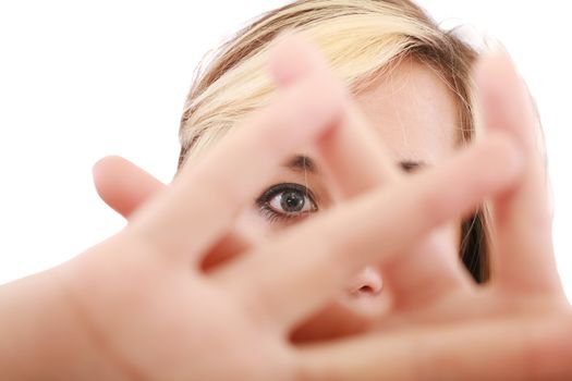 blonde female hide her face behind her hand, keep away gesture, isolated on white background