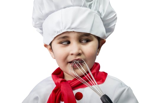 The cheerful little boy in a suit of the cook costs