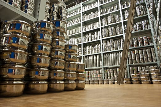 floors filled with dishes, cooking utensils. view from below