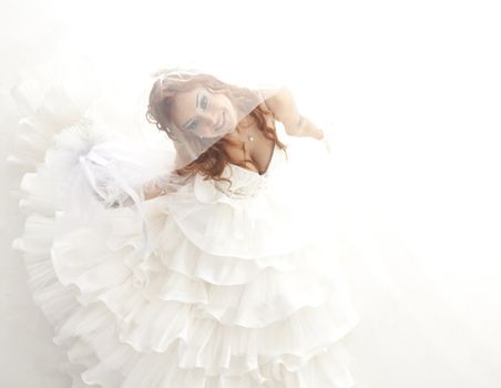 beautiful smiling bride on white background