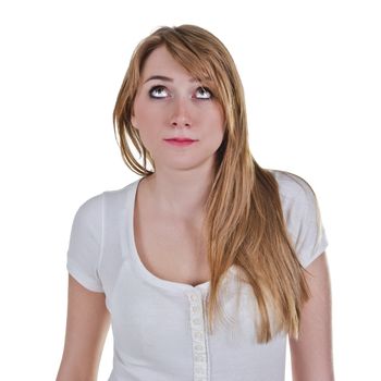 Young woman looking up with expression as she is thinking about something