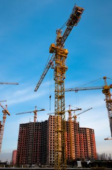 Crane stays in front of the new, constructing building