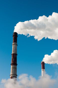 Two smoky tubes, standing with some fog near earth