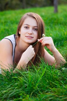 portrait of a beautiful young woman with flower  outdoor