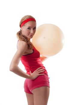 Sporty woman with fitness ball isolated on white background