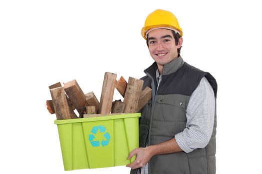craftsman holding a box with recycling materials