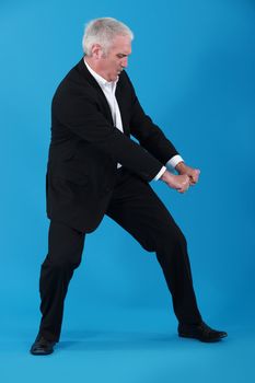 Businessman performing pull gesture