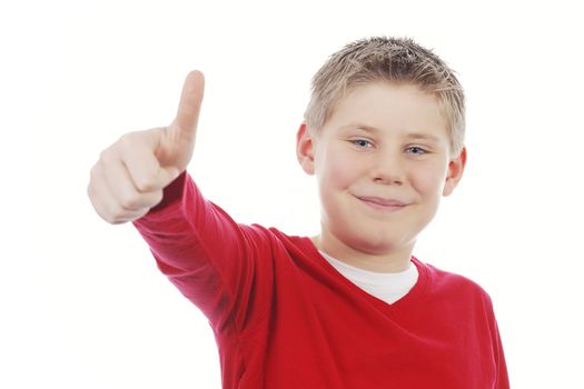 Young boy giving you thumb up isolated on white background 