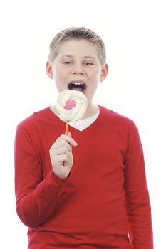 Portrait of beautiful joyful boy with big lollipop