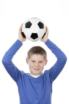 Cute boy holding a football ball