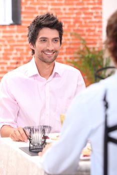 Couple having meal in restaurant