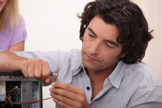 Man fixing a hard drive