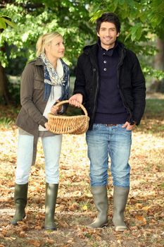 Couple collecting chestnuts