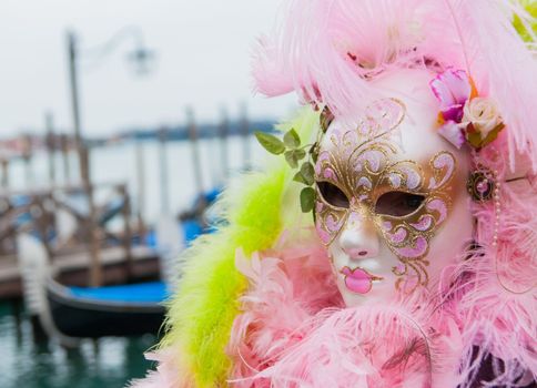 VENICE: An unidentified masked person in costume in St. Mark's Square during the Carnival of Venice, 2010.