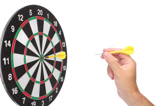 Hand throwing a yellow dart over white