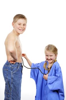 Children are playing doctor with stethoscope on white background