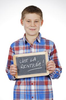 child holding slate on white background