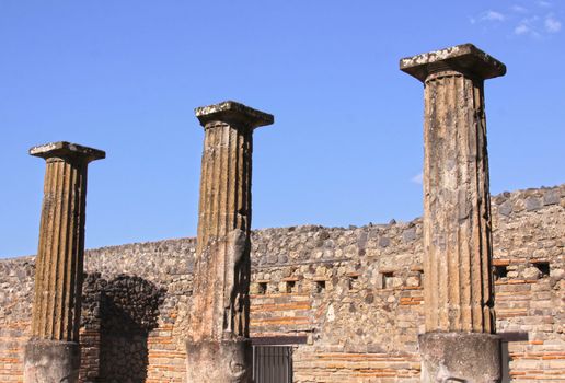 Three large preserved columns in the Roman city of Pompeii.  It was completely buried by an eruption of Mount Vesuvius in AD 79.
