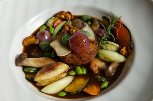 Image of a stew of vegetables and garnish