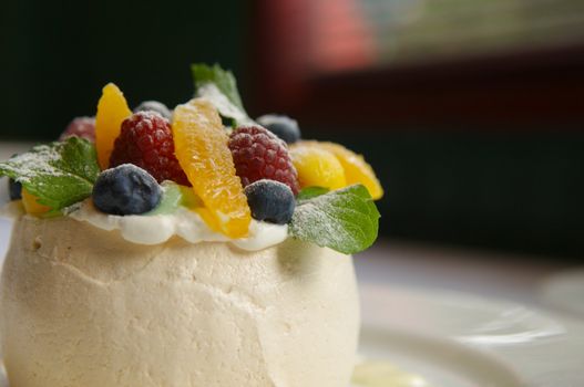 Image of merangue topped with mixed fruit