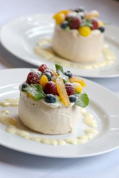 Image of merangue topped with mixed fruit