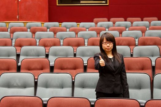 Businesswoman with thumbs up