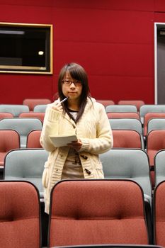 Asian student in lecture hall