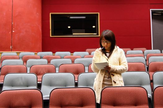 Asian student in lecture hall