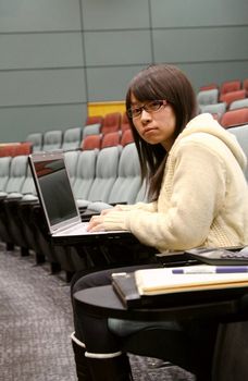 Asian student using laptop to study