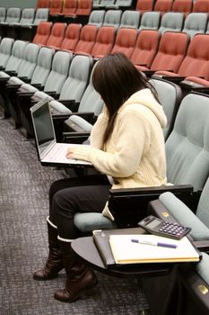 Asian student using laptop to study