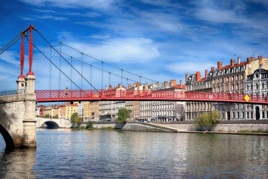 View of red footbridge in Lyon with Saone river,France