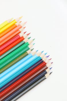 Color pencils arrange on white background