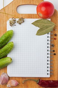 Notebook with recipes and shopping list in the kitchen