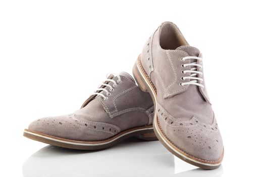 pair of grey men's shoes on white background