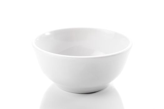 brand new white dish on bright background