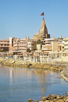 Dwarka Roadtrip. Portrait of Dwarka Bay, Arabian Sea and promenade from the public pathway leading upto the Shree Dwarakadheesh Krishna Temple a significant religious place and pilgrimage for hindus on the coast of Gujarat, India