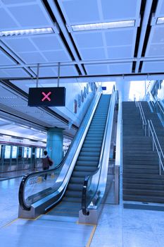 Moving escalator in train station