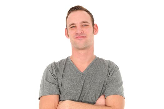 Attractive smiling man with arms folded isolated on white