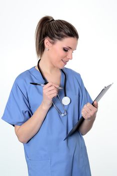 young woman doctor in uniforme with pen and stethoscope