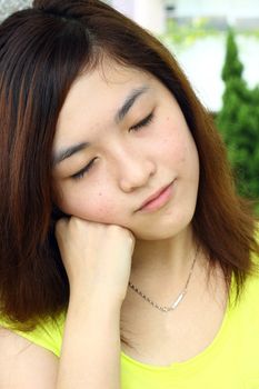 Asian woman with sleepy face