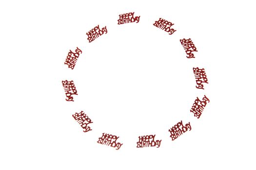 small lettering with happy birthday in a circle lying on a white background