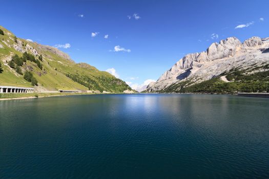 summer view of Fedaia lake and pass, Trentino, Italy