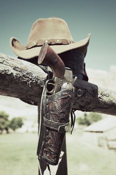 cowboy gun and hat outdoor under sunlight