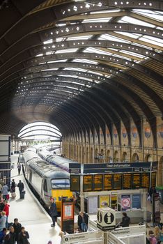 YORK, UK - MARCH 29: Trains at platform in York Railway Station. Inaugurated in 1877 and bombed during WW2, it is one of the most important railway junctions in the British network. March 29, 2013 in York.