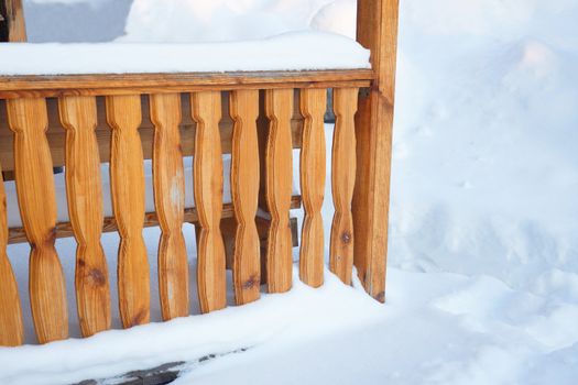 Fragment of rural outdoor porch in winter season