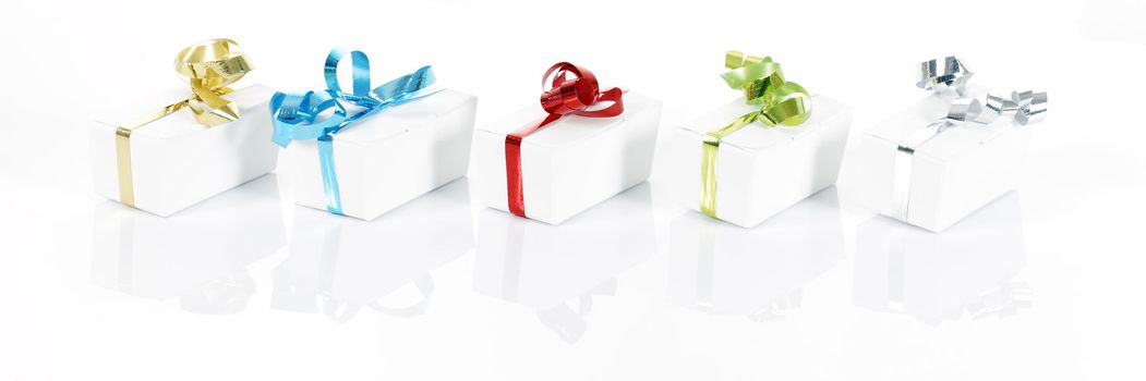 Set of colorful gift boxes with bows and ribbons. 