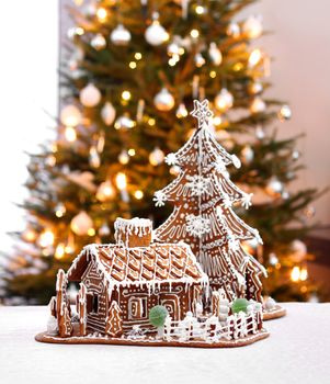 Gingerbread cottage house and Christmas tree home interior background