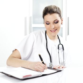 doctor with pen and stethoscope in hospital