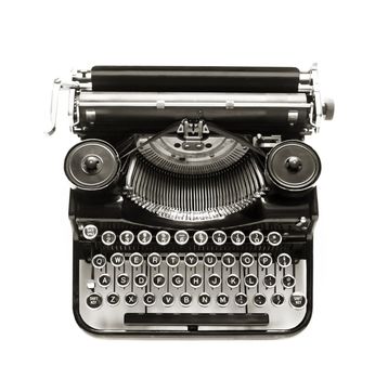 Antique typewriter against a crisp white backdrop.