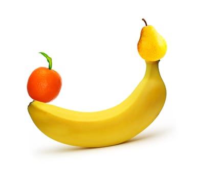 banana and ripe pear with tangerine - concept image